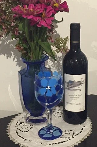 Drop in and do a wine tasting and try our Homestead Red, a light, dry, Bordeaux style wine. And take home a hand painted wine glass for half price, this weekend only!